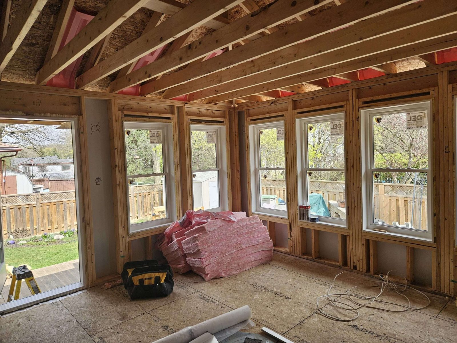 Interior framing with studs and new windows during a Malamar build