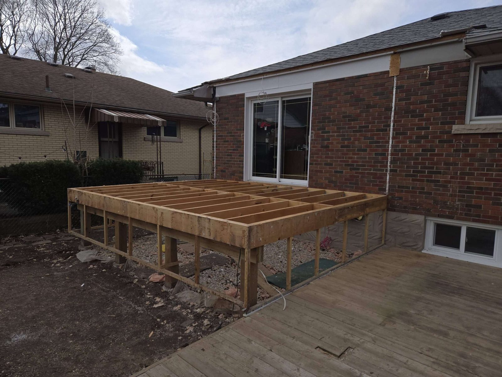Backyard cedar deck build by Malamar Construction